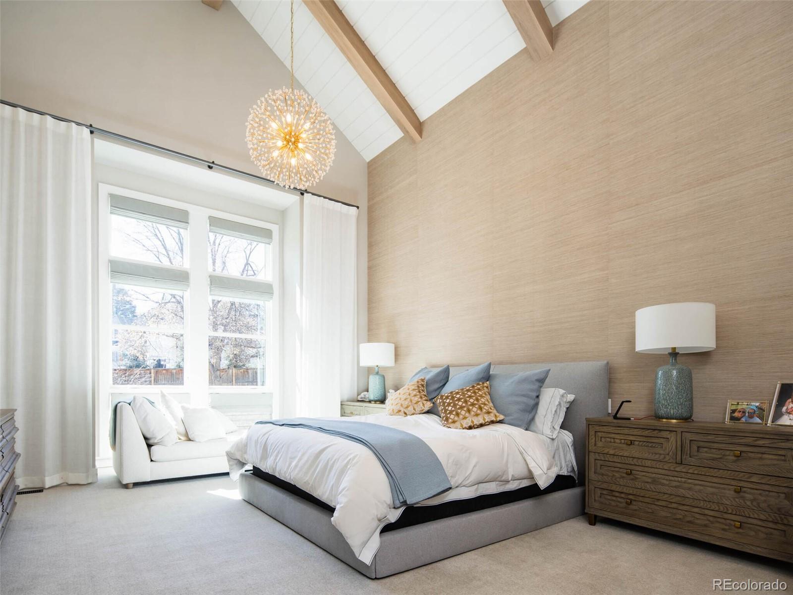 2550 Cherryridge Road Englewood, CO 80113 - Photo 18 of 40 a spacious bedroom with a bed and a large window