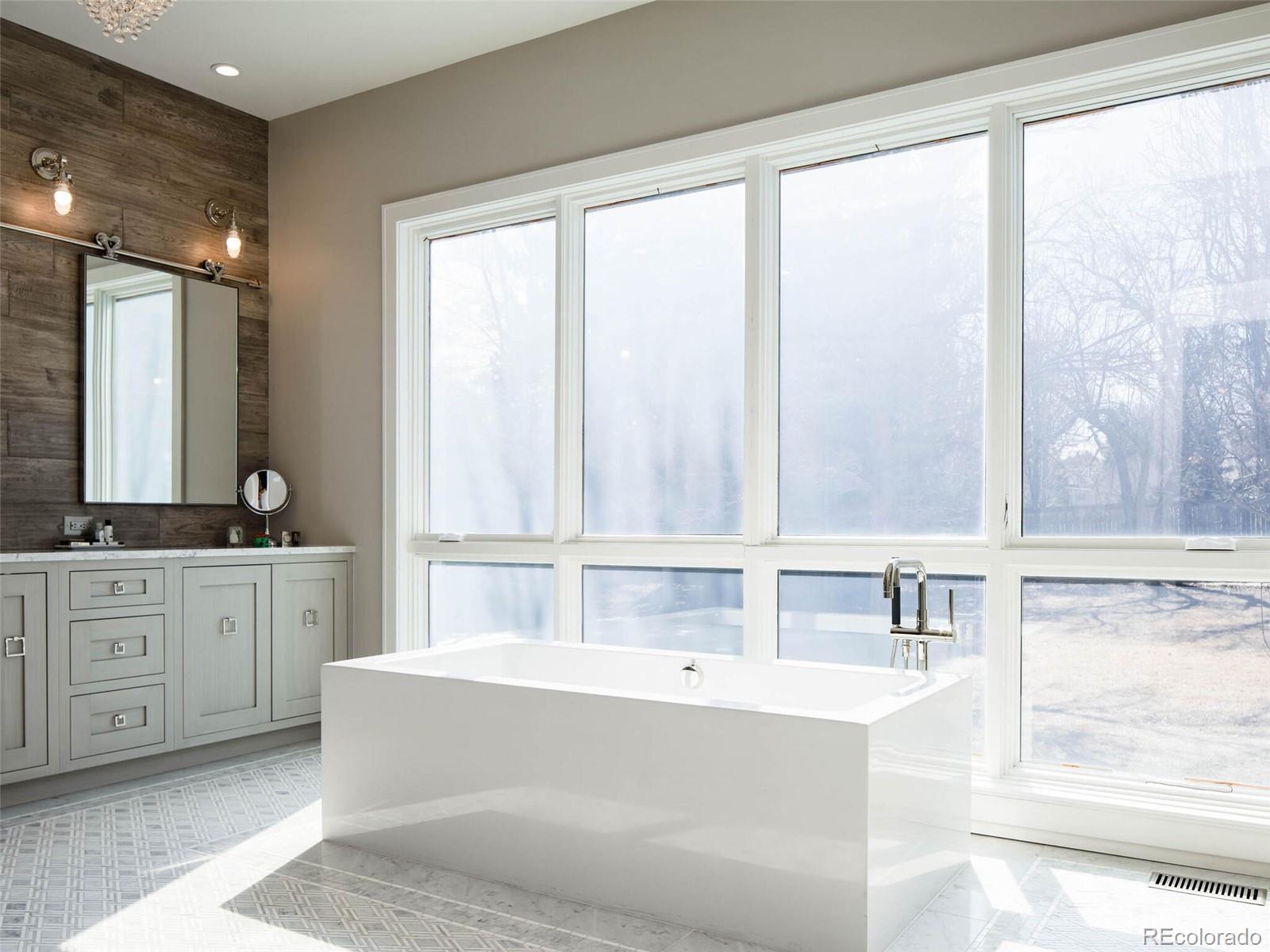2550 Cherryridge Road Englewood, CO 80113 - Photo 20 of 40 a bathroom with a tub a sink and a window