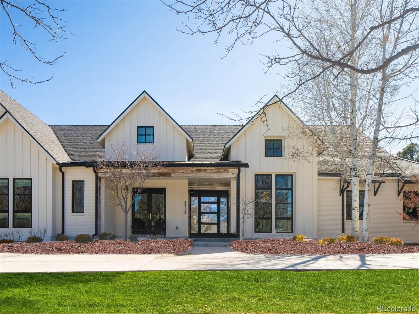 2550 Cherryridge Road Englewood, CO 80113 - Photo 2 of 40 a front view of a house with a yard