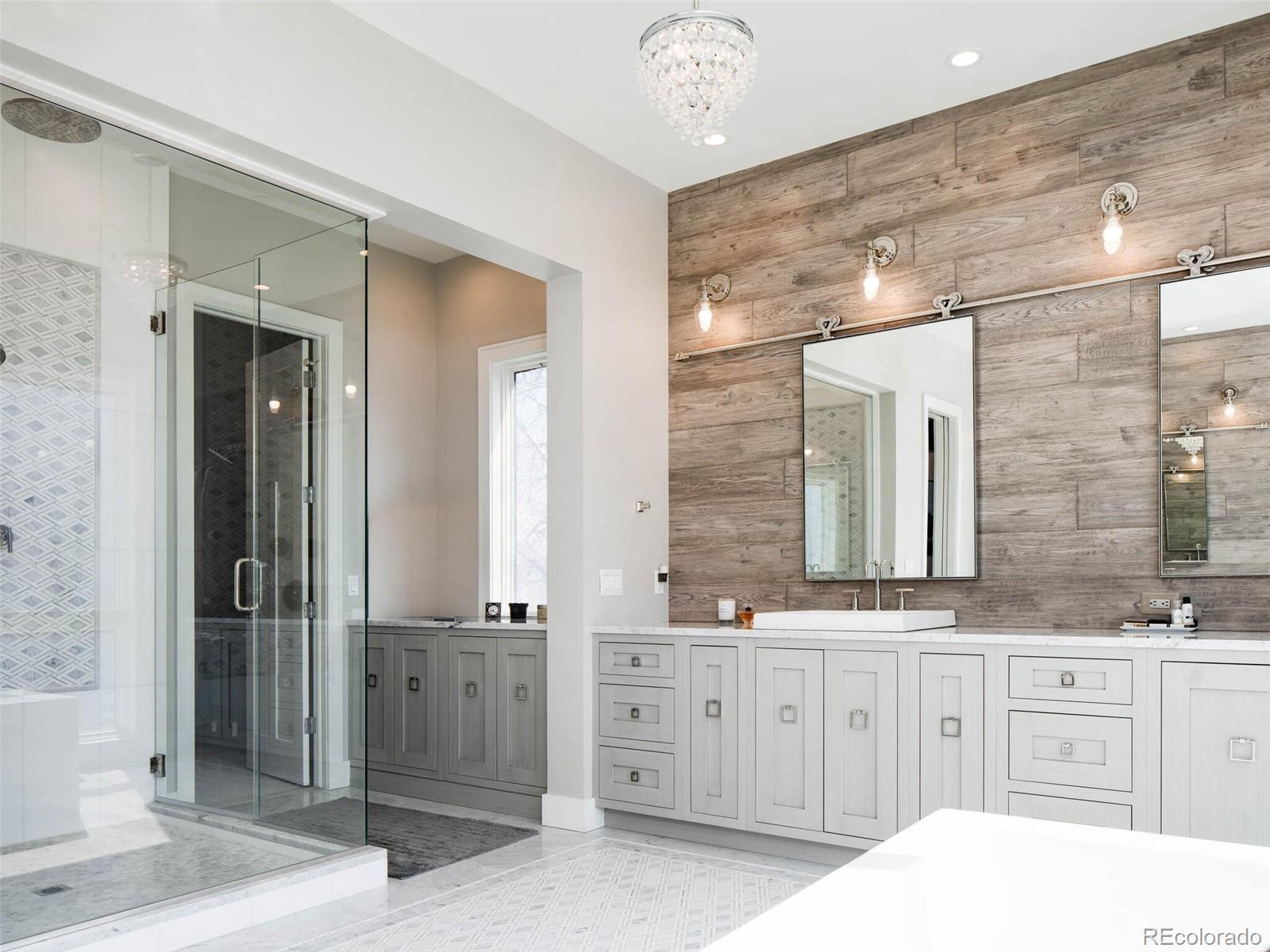 2550 Cherryridge Road Englewood, CO 80113 - Photo 21 of 40 a spacious bathroom with a granite countertop sink mirror and shower