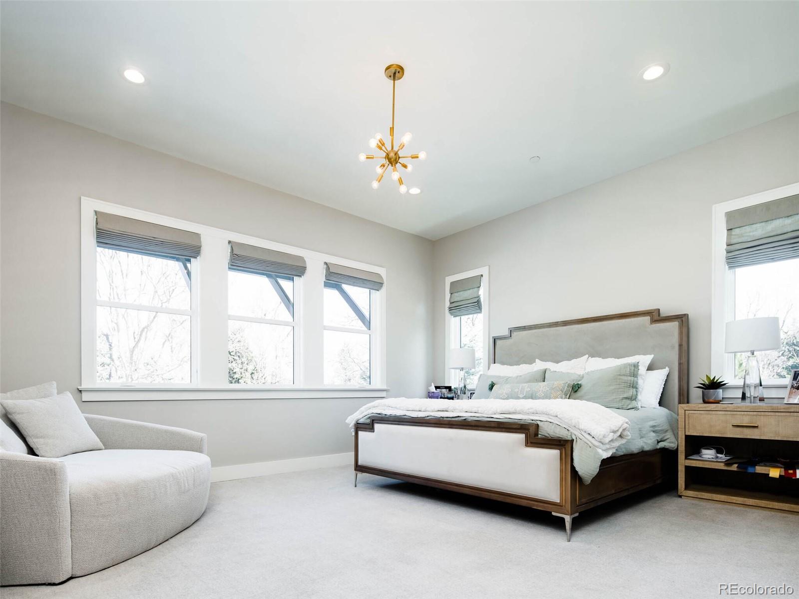2550 Cherryridge Road Englewood, CO 80113 - Photo 26 of 40 a bedroom with a bed couch and window