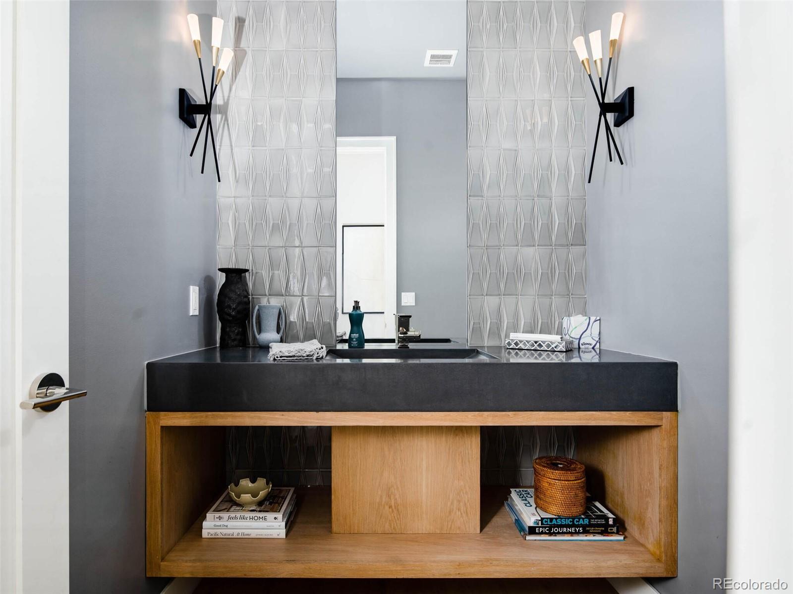 2550 Cherryridge Road Englewood, CO 80113 - Photo 29 of 40 a closeup of a sink and a mirror