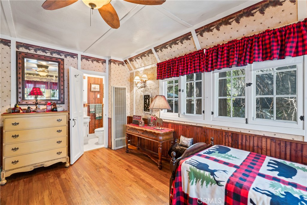 197 Rocky Point Road Lake Arrowhead, CA 92352 - Photo 18 of 35 a bedroom with furniture and a window