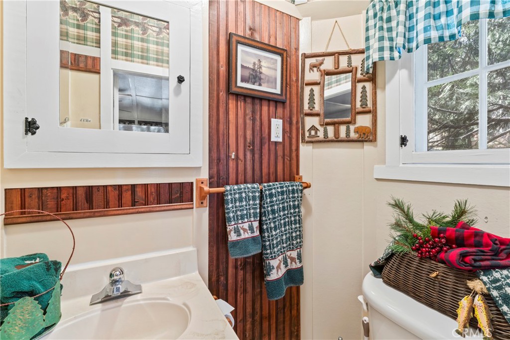 197 Rocky Point Road Lake Arrowhead, CA 92352 - Photo 19 of 35 a bathroom with a sink and a mirror