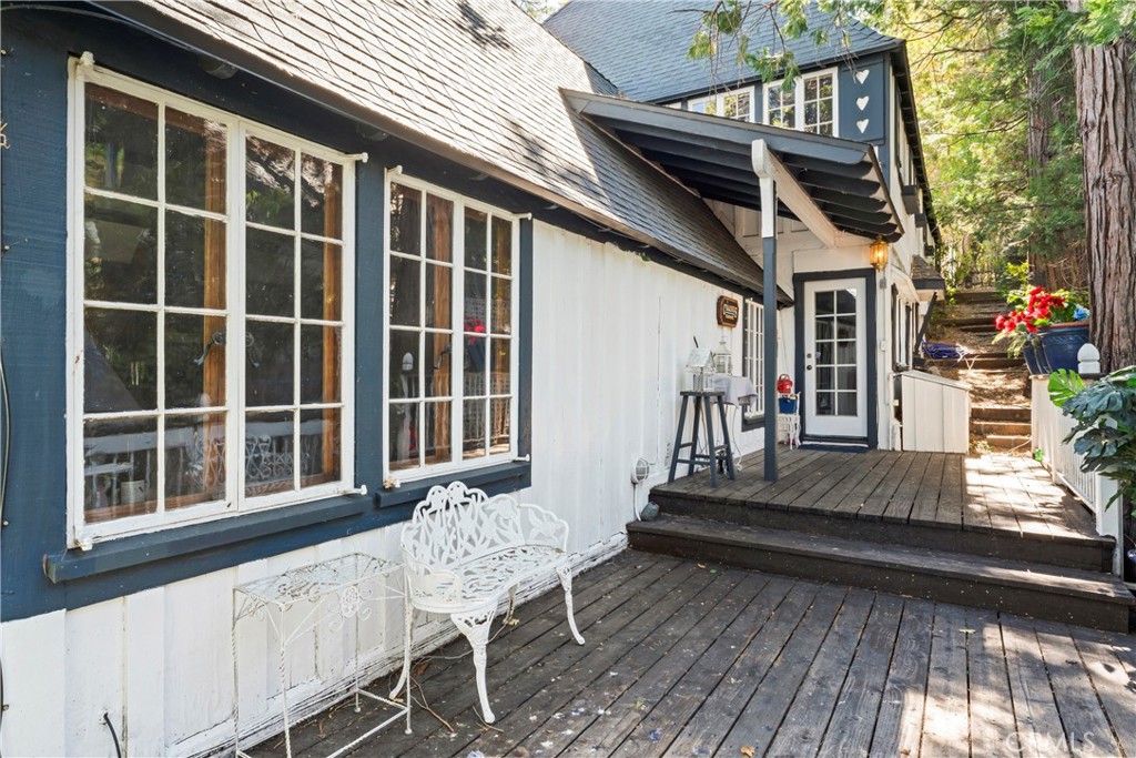 197 Rocky Point Road Lake Arrowhead, CA 92352 - Photo 25 of 35 a view of a house with backyard and deck