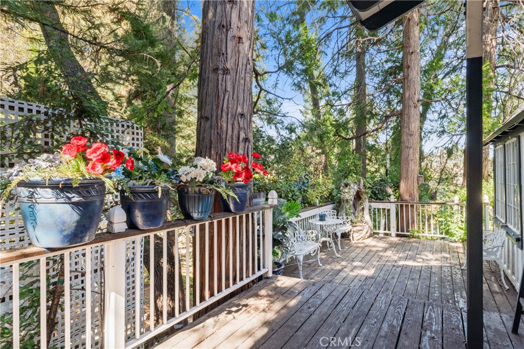 197 Rocky Point Road Lake Arrowhead, CA 92352 - Photo 26 of 35 a view of a porch and garden