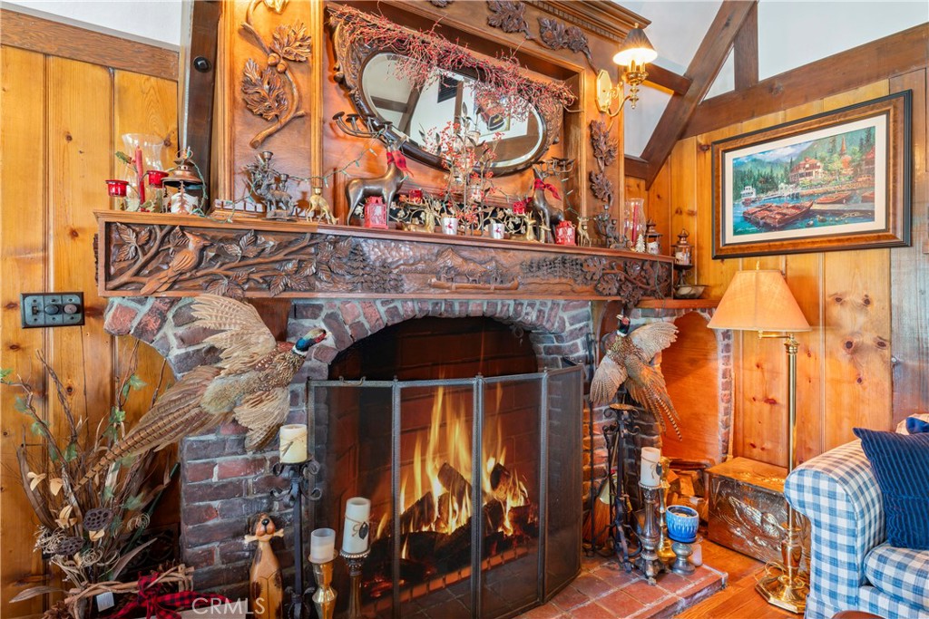 197 Rocky Point Road Lake Arrowhead, CA 92352 - Photo 7 of 35 a front view of a building with glass windows and door