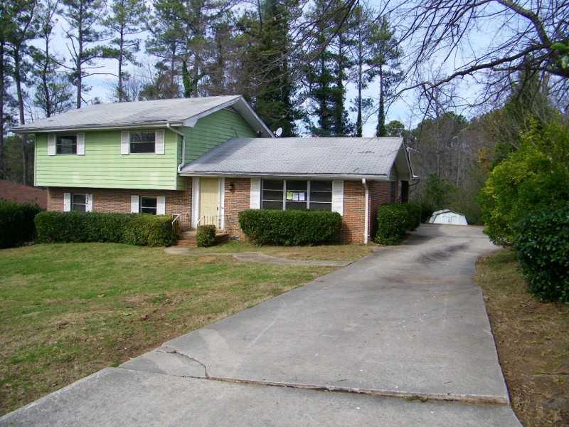 2398 Manassas Lane Decatur, GA 30034 - Photo 1 of 1 a front view of a house with a garden