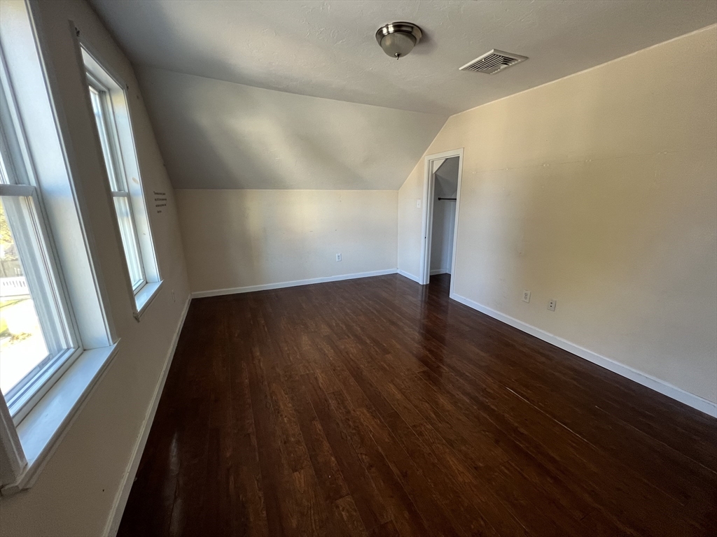 22 Forest Avenue Clinton, MA 01510 - Photo 11 of 13 a view of an empty room with wooden floor and a window