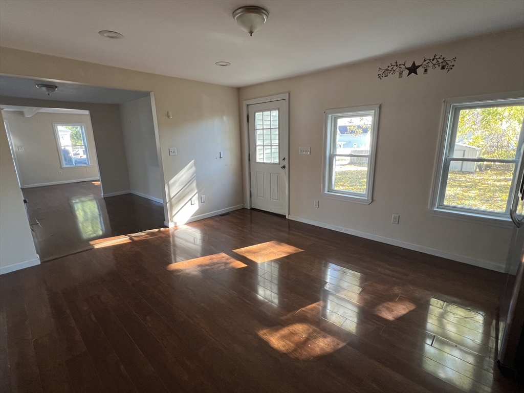 22 Forest Avenue Clinton, MA 01510 - Photo 7 of 13 a view of an empty room with window and wooden floor