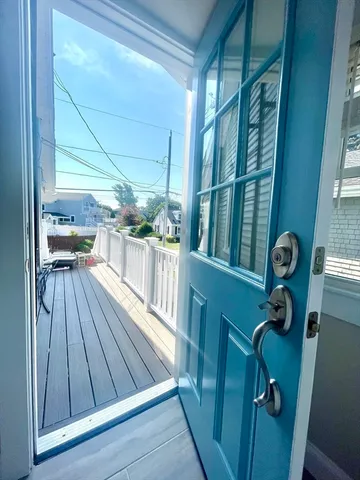 a view of entryway with wooden floor