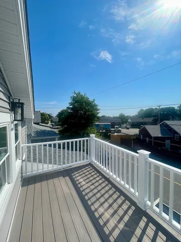 a view of deck with wooden floor and fence
