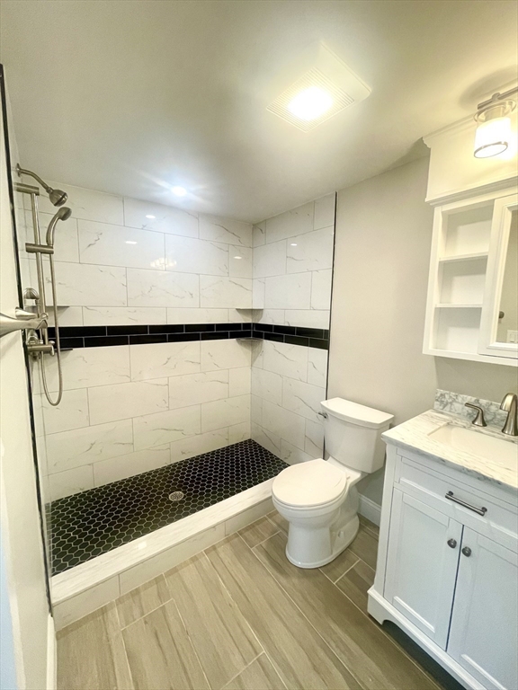 435 Newport Road, Unit 2 Hull, MA 02045 - Photo 25 of 38 a bathroom with a sink a toilet a mirror and shower