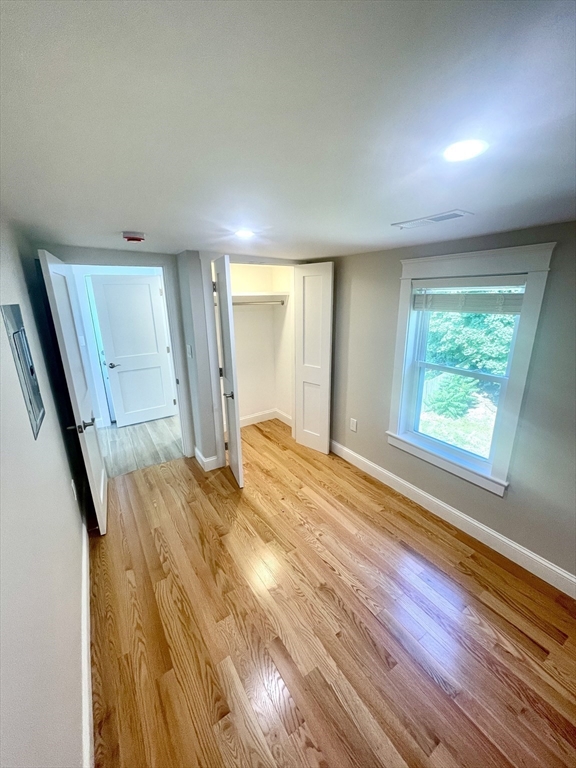 435 Newport Road, Unit 2 Hull, MA 02045 - Photo 29 of 38 a view of empty room with wooden floor and fan