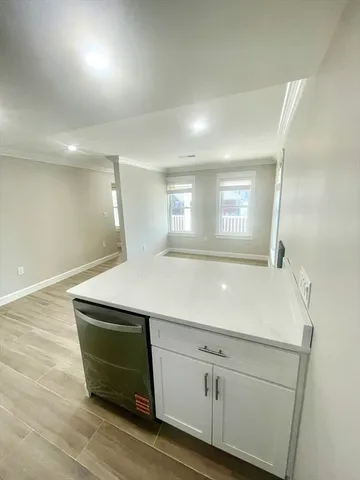 a room with a sink and dishwasher