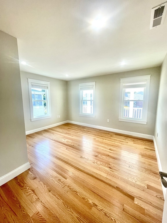 435 Newport Road, Unit 2 Hull, MA 02045 - Photo 9 of 38 wooden floor in an empty room with a window