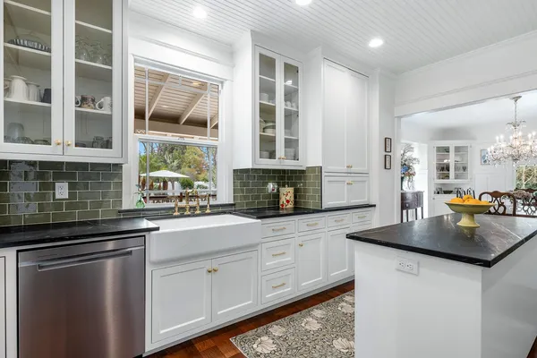 a kitchen with a sink and cabinets