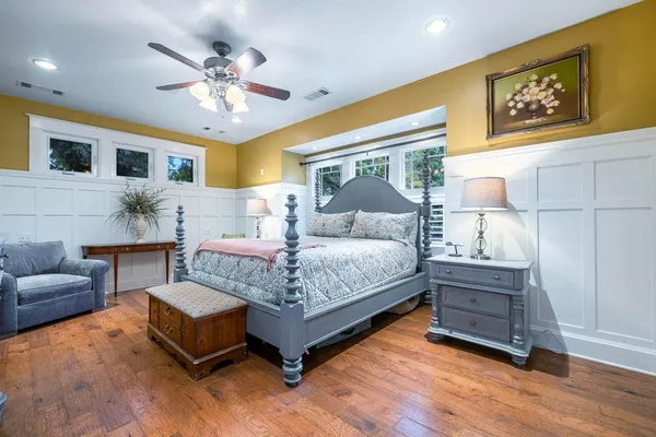 a bathroom with a double vanity sink a mirror and a shower
