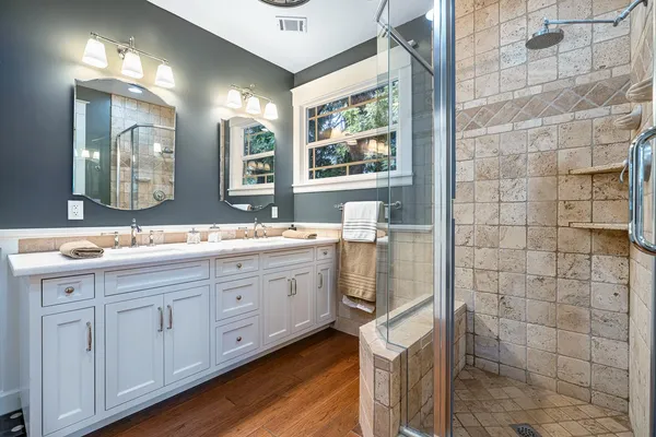 a bedroom with a bed couch and window