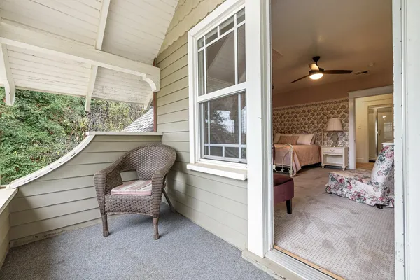 a bathroom with a granite countertop toilet sink and mirror