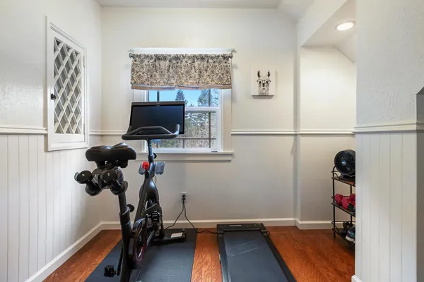 a balcony with furniture and wooden floor
