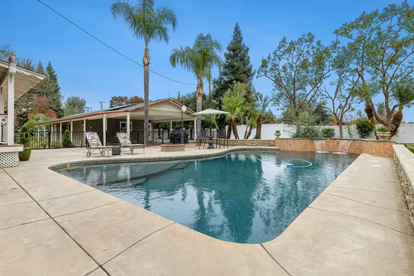 a view of road with large trees