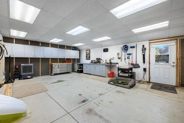 an aerial view of a house with garden space and street view