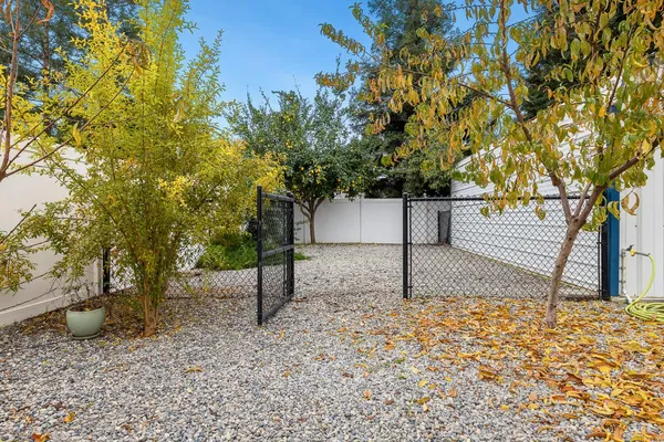 an aerial view of a house with a yard and garden