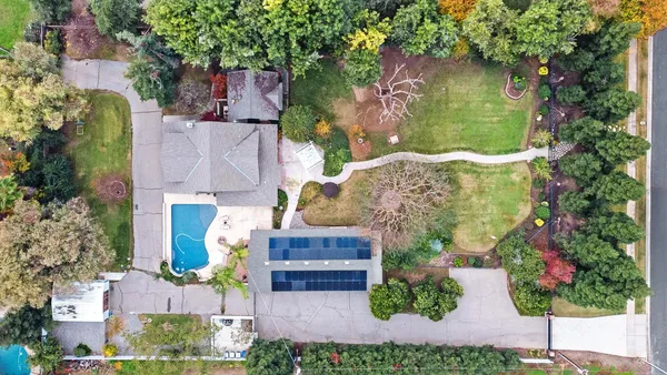 a view of a swimming pool with a patio