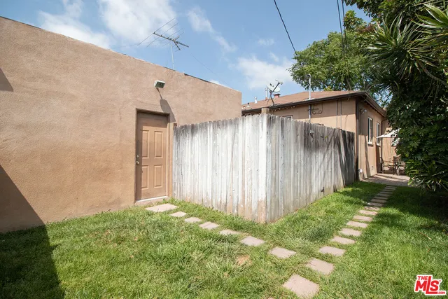 a patio with a patio table and chairs