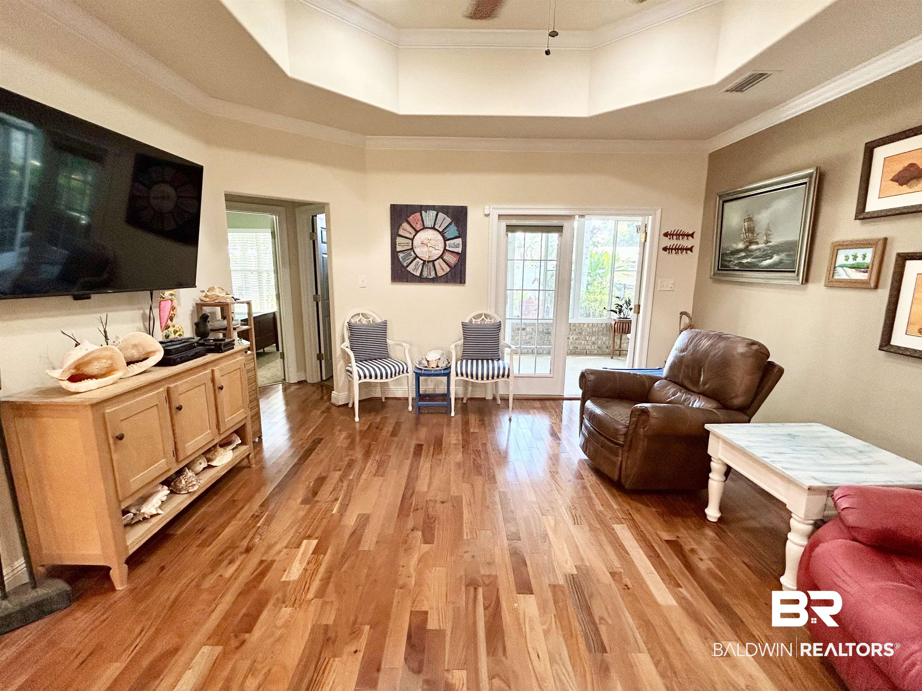 177 Mark Twain Loop Foley, AL 36535 - Photo 3 of 47 Hardwood Floors, Tray Ceiling, French Doors to Sunroom.