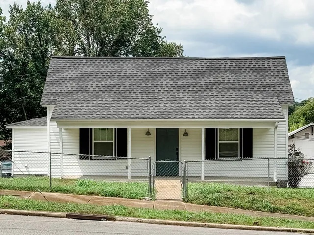 a front view of a house with garage