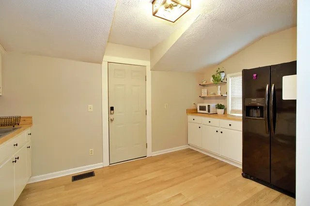 a room with a dresser and mirror