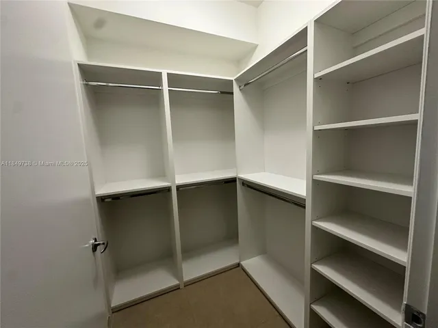 a view of a room with a large window