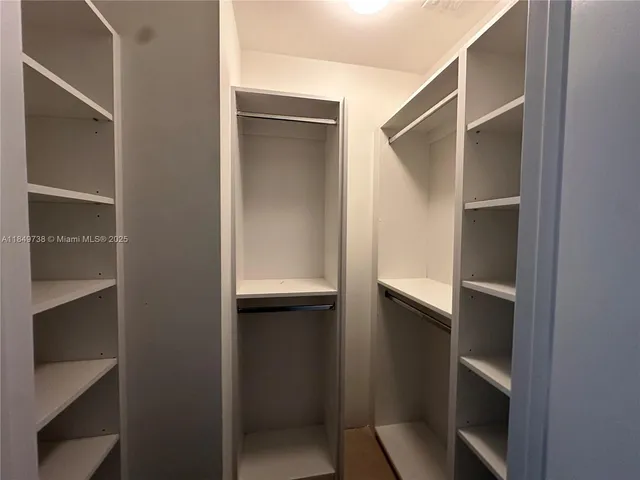 a bathroom with a granite countertop sink mirror and double