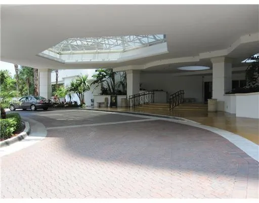 a view of hallway with furniture and wooden floor