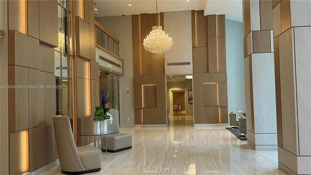 a living room with couch and a floor to ceiling window