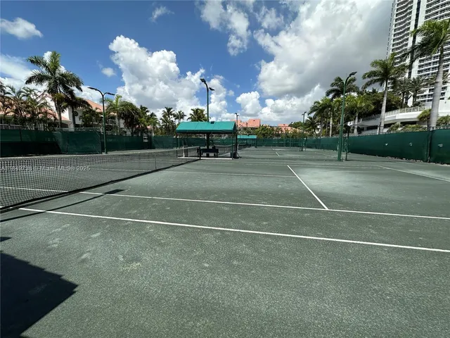 a view of a swimming pool and lounge chairs in patio