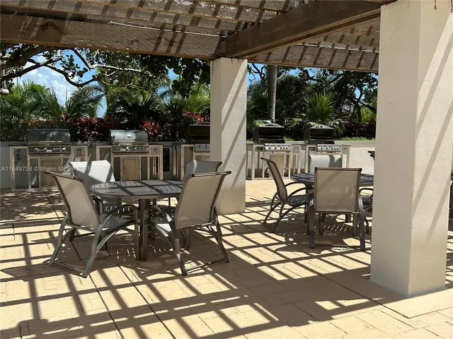a view of swimming pool with outdoor seating
