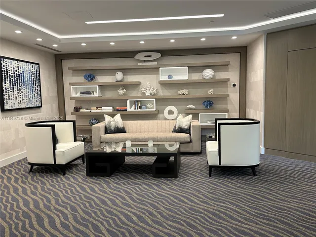 a view of a dining room with furniture and window