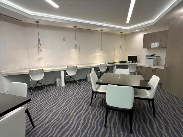 a view of a living room and a floor to ceiling window