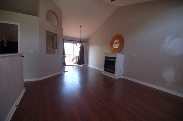 4759 West Westvale Road Northeast Roanoke, VA 24019 - Photo 3 of 13 a view of an empty room with wooden floor fireplace and a window