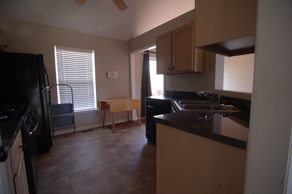 4759 West Westvale Road Northeast Roanoke, VA 24019 - Photo 5 of 13 a kitchen with a sink and a refrigerator