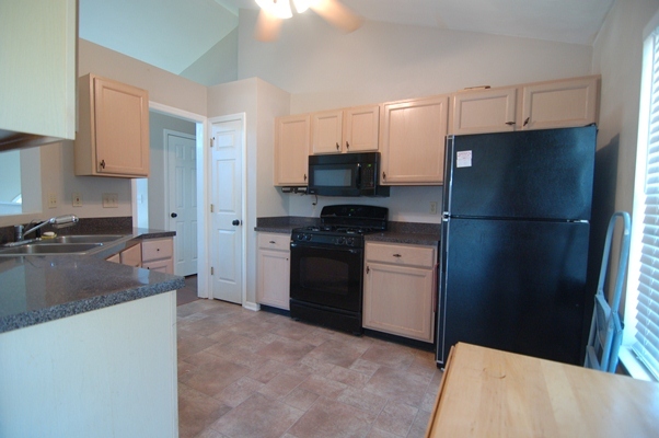 4759 West Westvale Road Northeast Roanoke, VA 24019 - Photo 6 of 13 a kitchen with a refrigerator stove and a sink