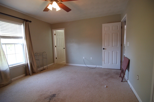 4759 West Westvale Road Northeast Roanoke, VA 24019 - Photo 9 of 13 an empty room with windows and cabinet