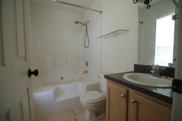 4759 West Westvale Road Northeast Roanoke, VA 24019 - Photo 10 of 13 a bathroom with a sink toilet vanity and shower