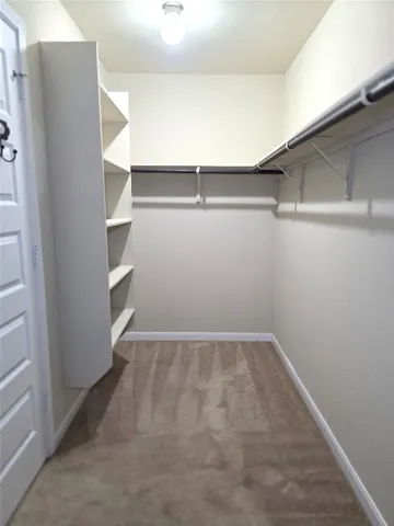 a view of an empty walk in closet
