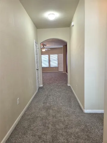 an empty room that has a window in it