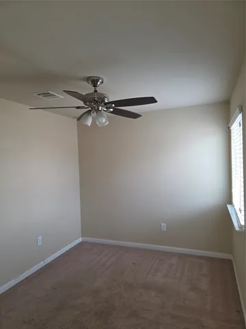 a view of a small space with a fan