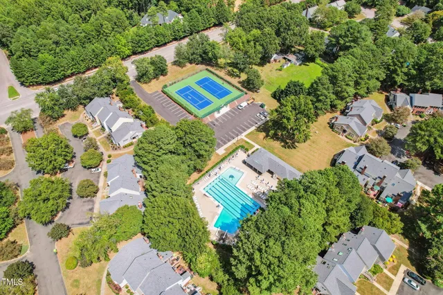 a kitchen with stainless steel appliances granite countertop a refrigerator a stove top oven a sink and cabinets